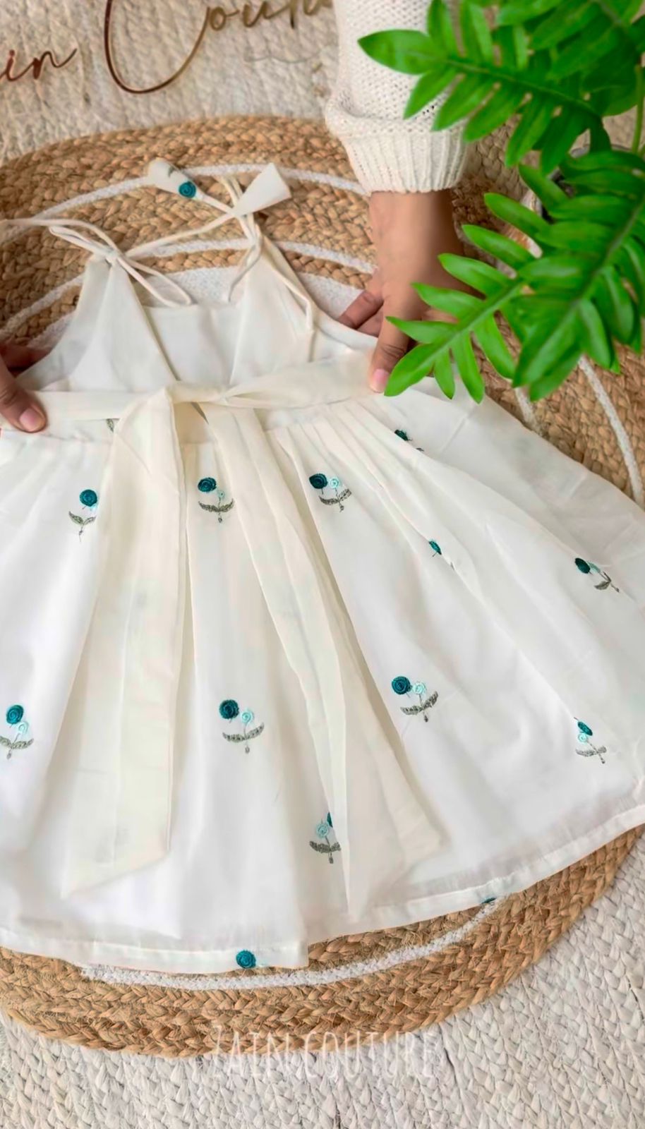 Enchanting Blossom: Ivory Strappy Frock with Teal Floral Embroidery